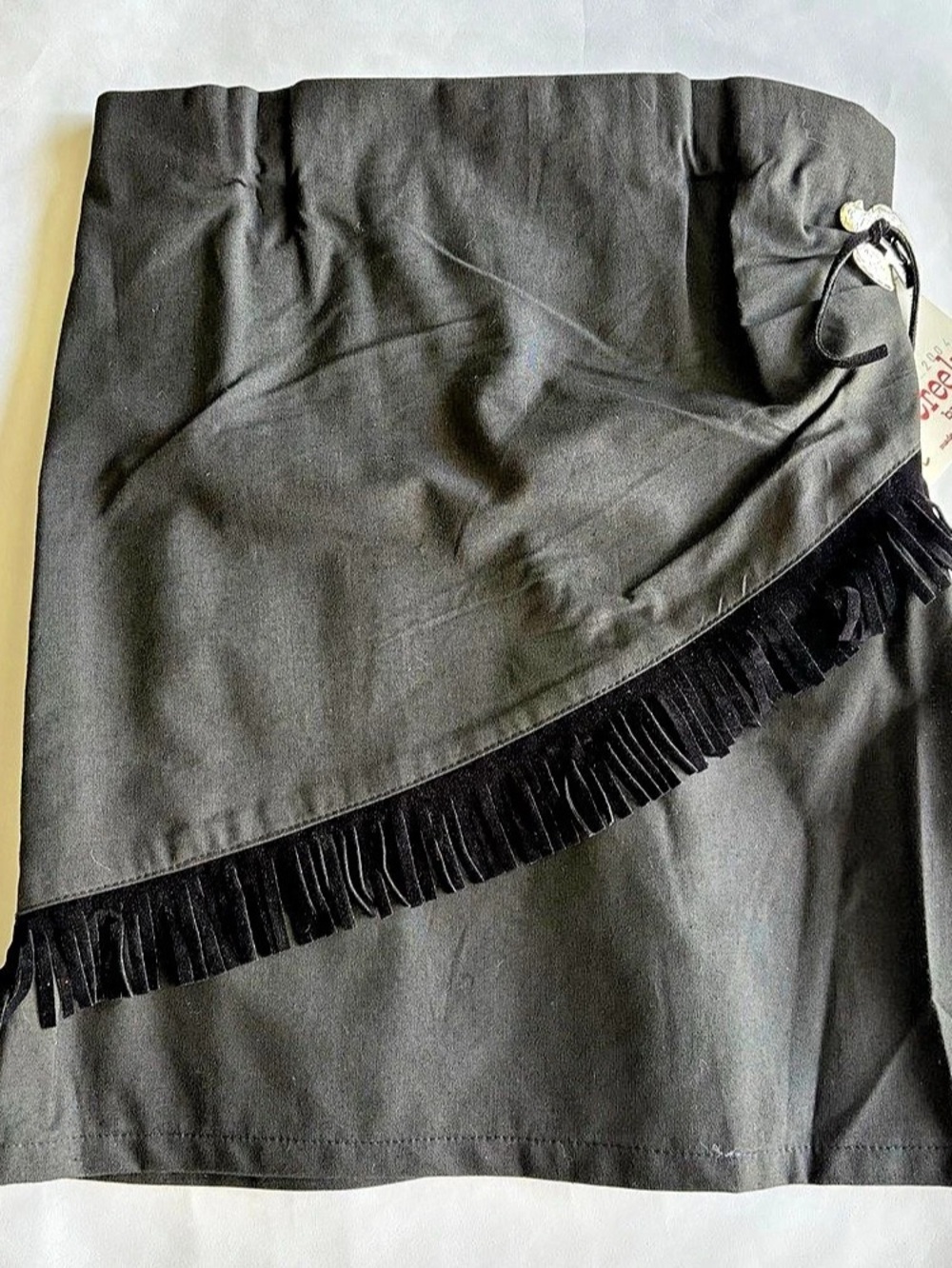 Girl’s XL Cowgirl Skirt With Fringe and Decorative Silver Toned Buckle. NWT